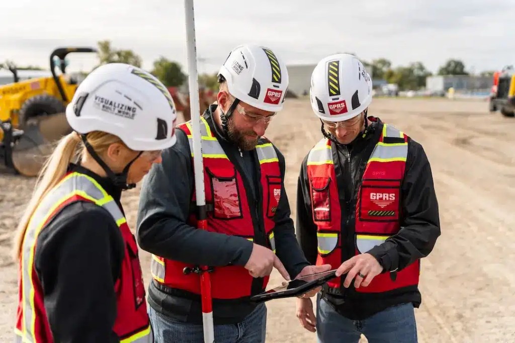 GPRS Project Managers on construction site using a tablet viewing SiteMap