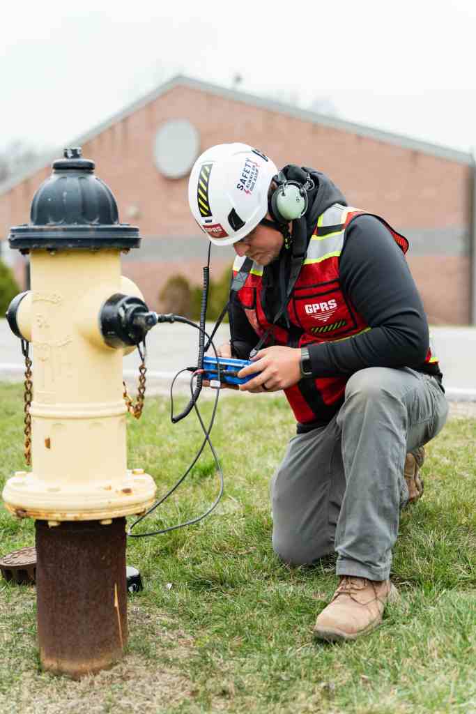GPRS Feild member detecting a fire hydrant for a leak