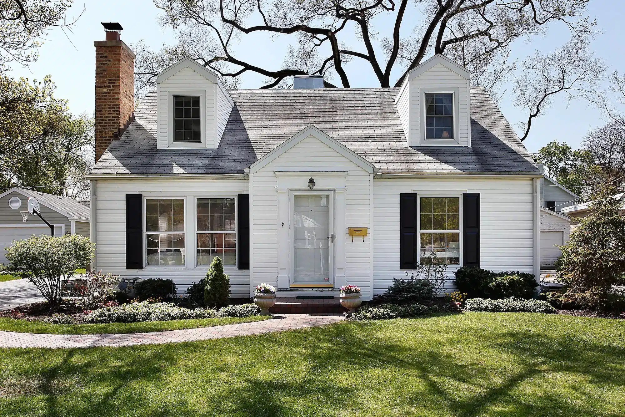 white single story house with black shutters 