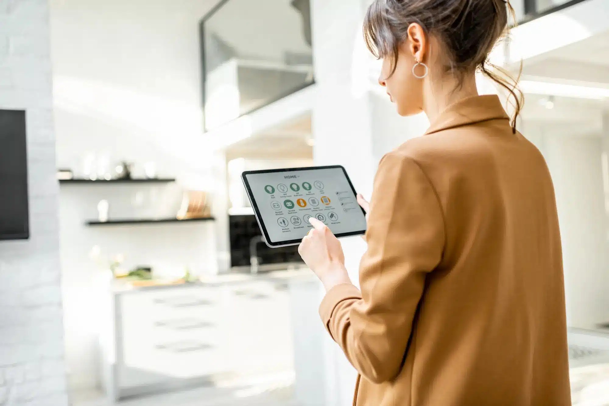 woman using a tablet for her smart home