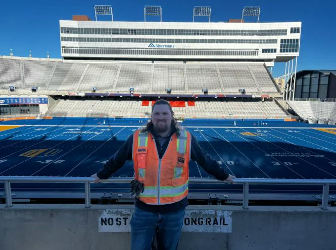 GPRS Project Manager in front of a football stadium