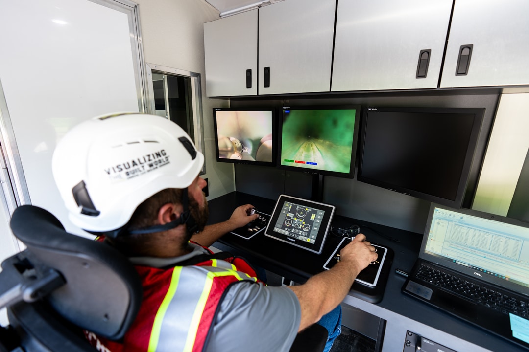 GPRS Project Manager looking at monitors for Video Pipe Inspection