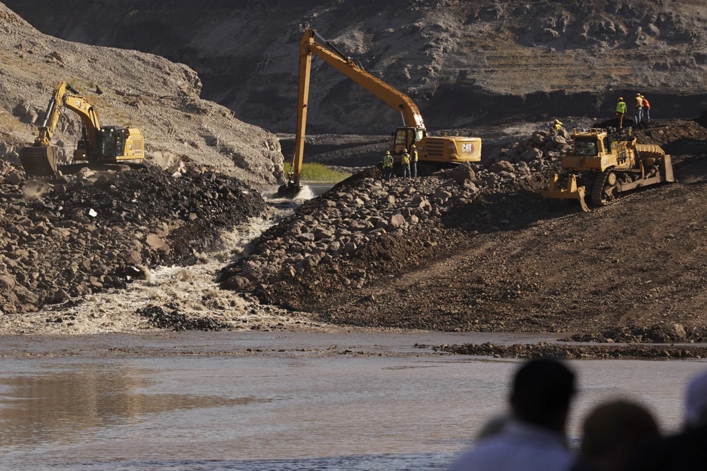 Excavators remove the rubble of a dam on the Klamath River.